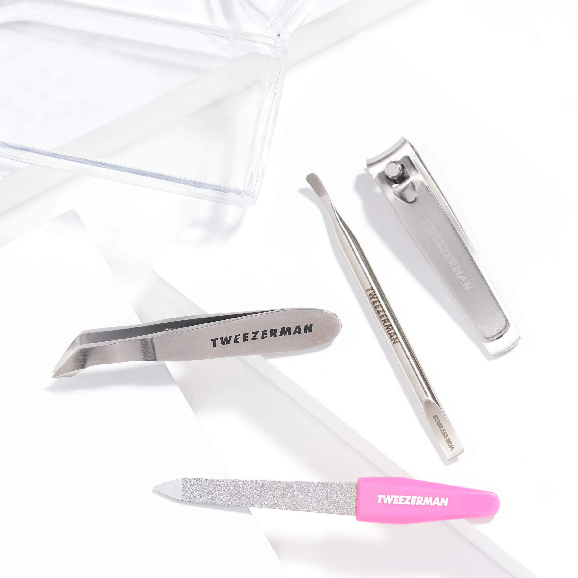 TWEEZERMAN Manicura y pedicura (4 piezas, mini set de emergencia, set de viaje para cualquier bolso, con cortaúñas, lima de uñas), rosa